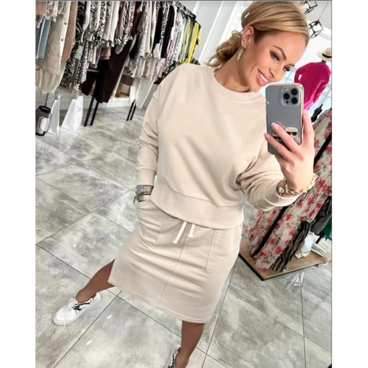 Ladies set Lara in beige by ToroModa  https://www.toromoda.com/products/womens-set-lara-in-beige  A wonderful set of a long-sleeved sweatshirt and a knee-length skirt with a slit and pockets. Elastic band and active waist ties.