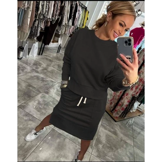 Ladies set Lara in black by ToroModa  https://www.toromoda.com/products/womens-set-lara-in-black  A wonderful set of a long-sleeved sweatshirt and a knee-length skirt with a slit and pockets. Elastic band and active waist ties.